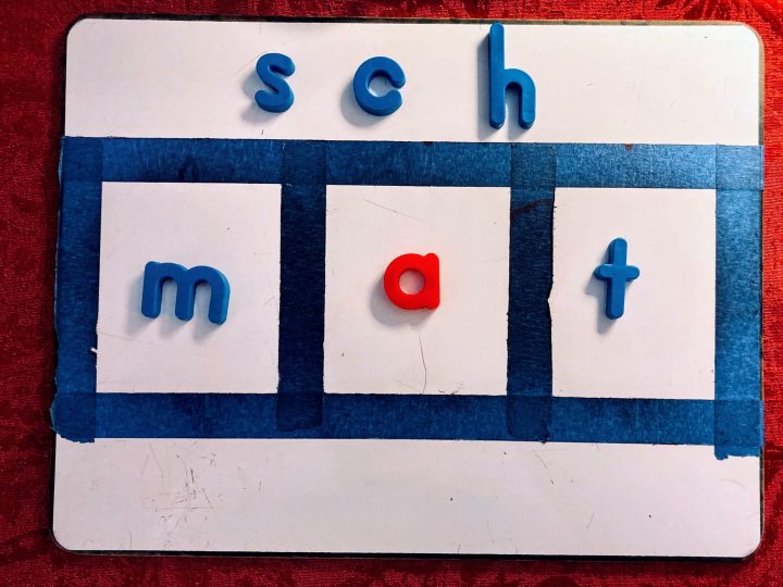 home made sound board with blue and red magnetic letters for teaching reading