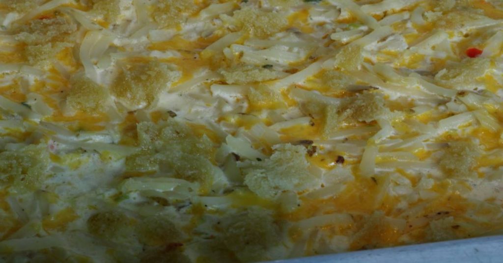 Cheesy potatoes hot from oven close up.